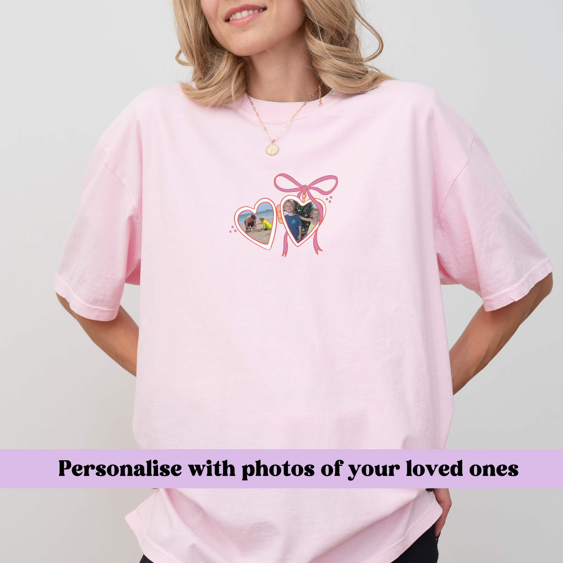 a woman wearing a pink shirt with two hearts on it