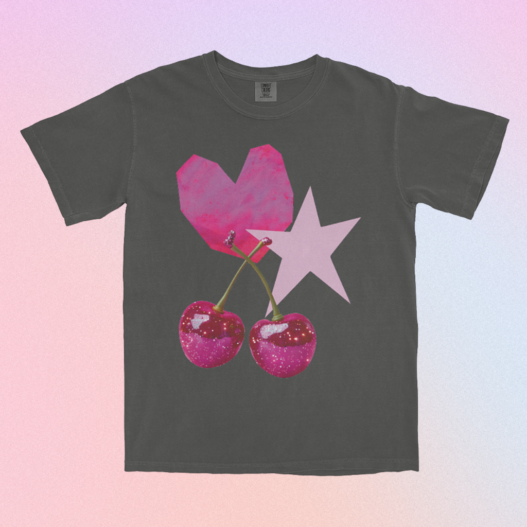 Gray t-shirt with pink heart, star, and cherries design on a gradient background