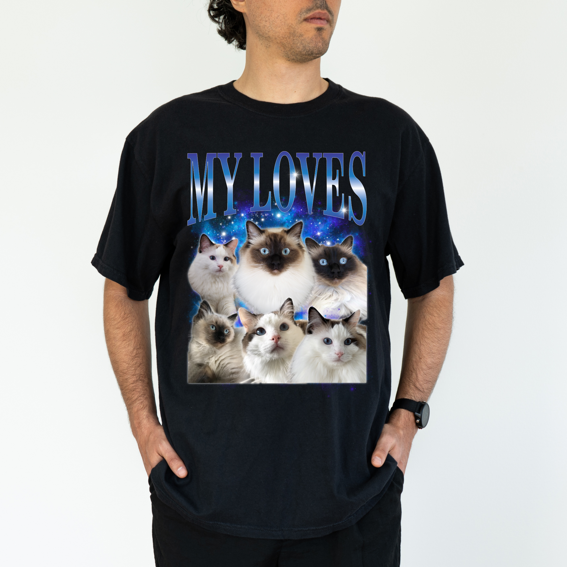 a man wearing a black t - shirt with a picture of a group of cats