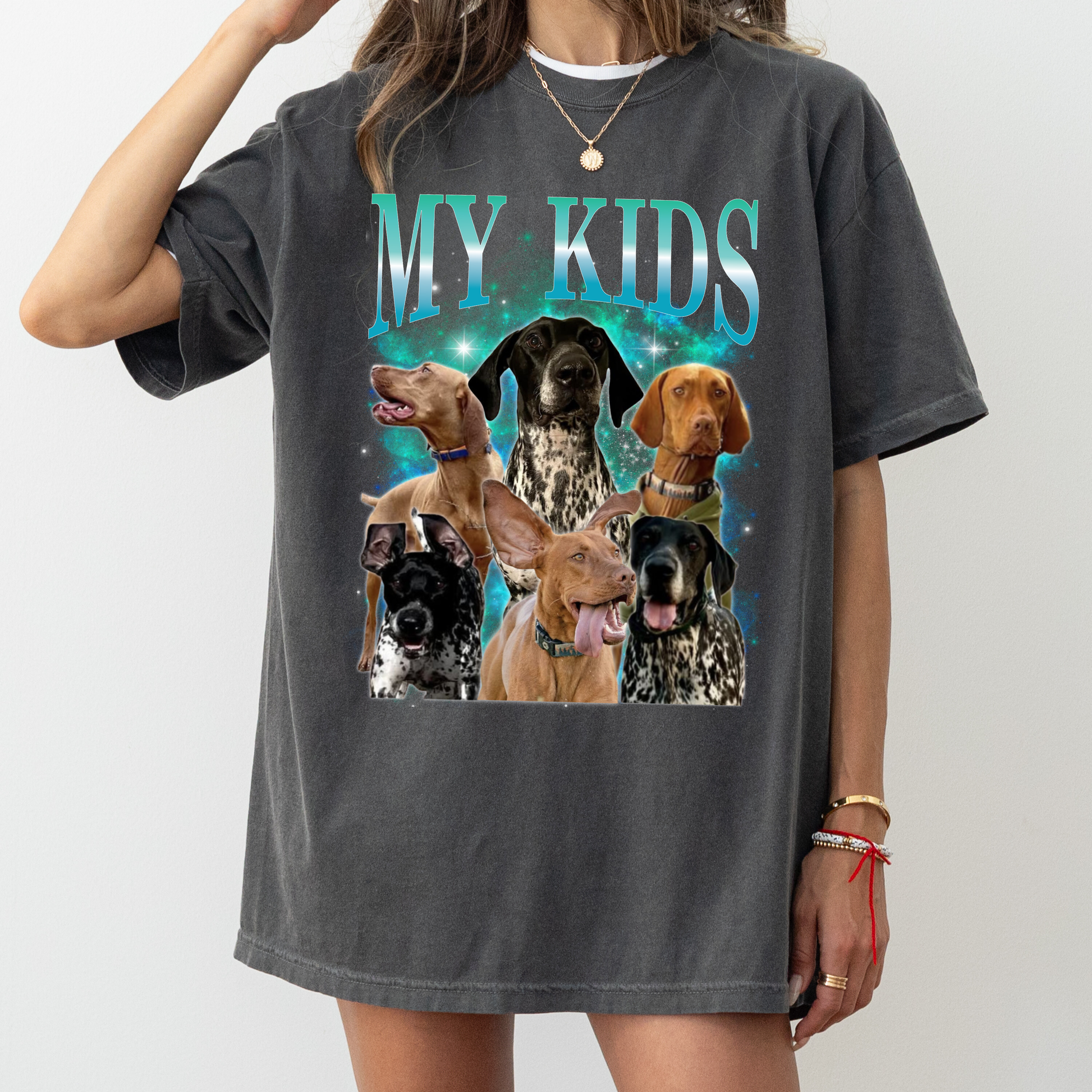 a woman wearing a t - shirt with dogs on it