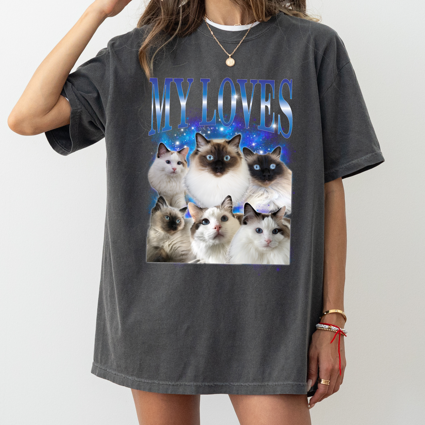 a woman wearing a t - shirt with a picture of cats on it