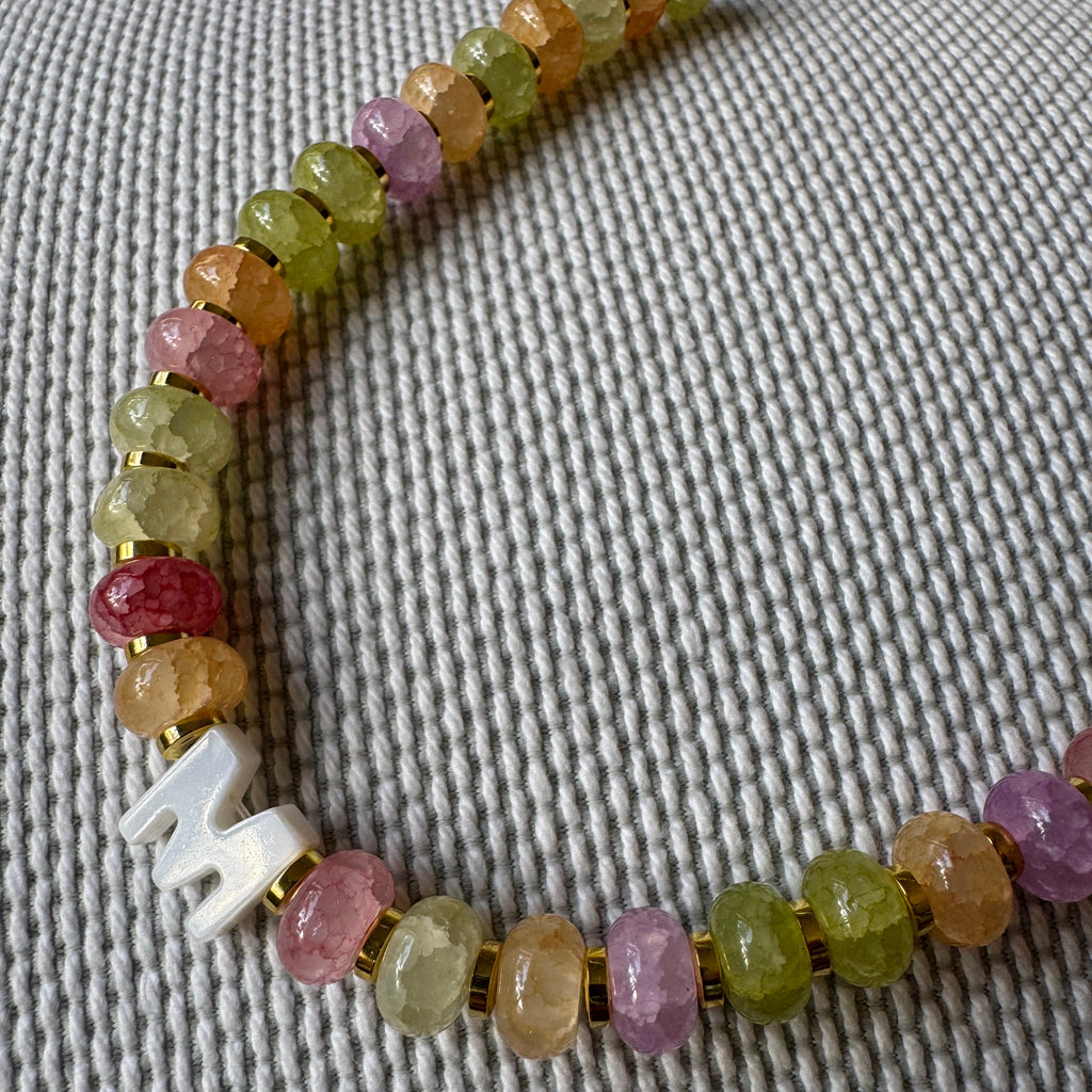 multicoloured beads with a custom initial