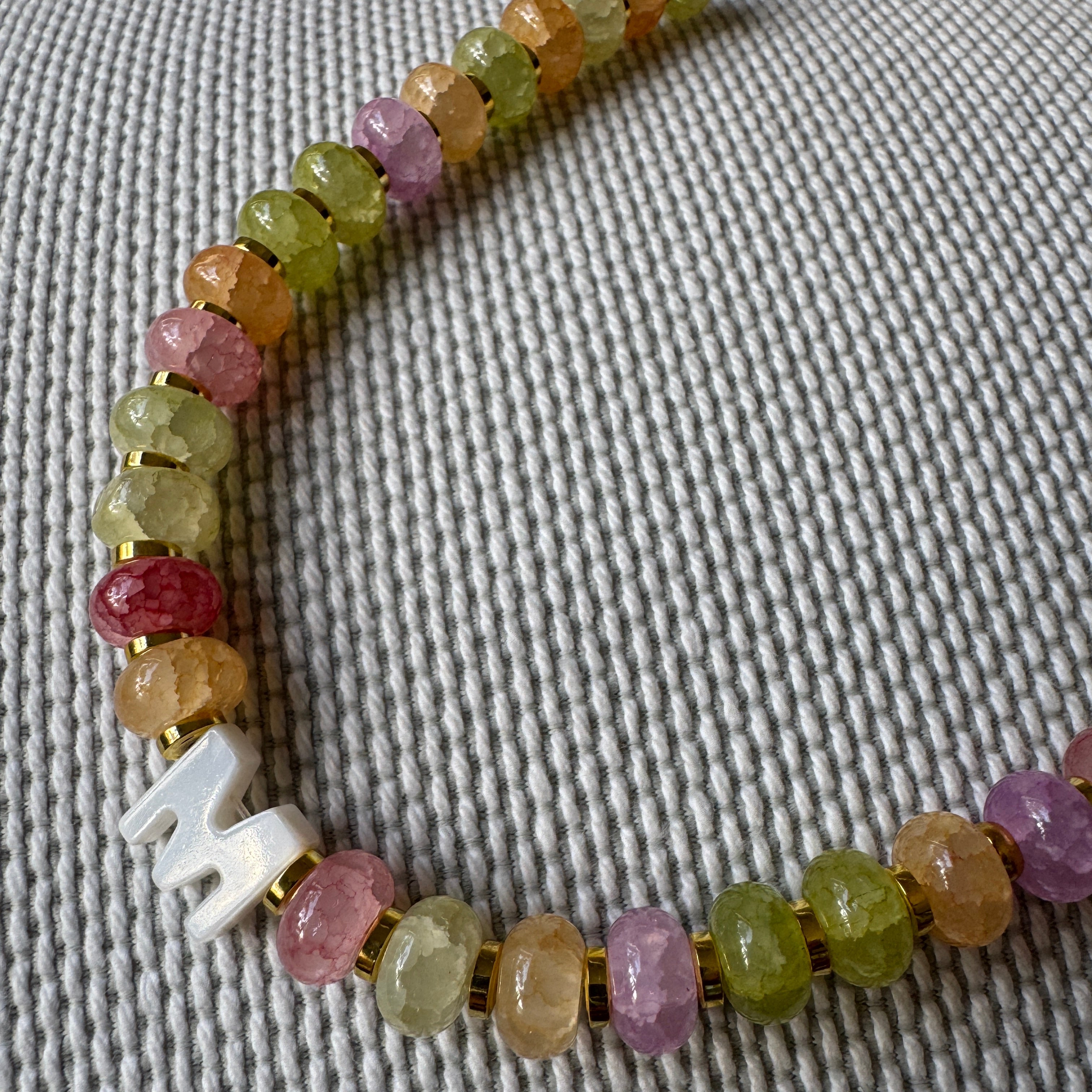 multicoloured beads with a custom initial