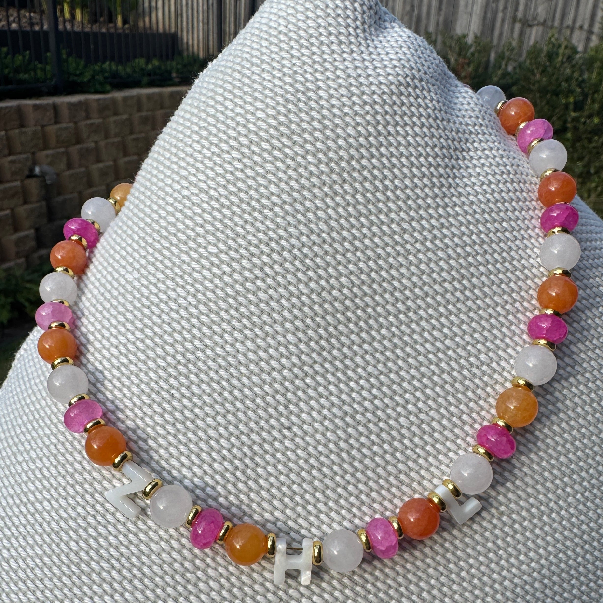 Multicolored beaded bracelet on a textured surface